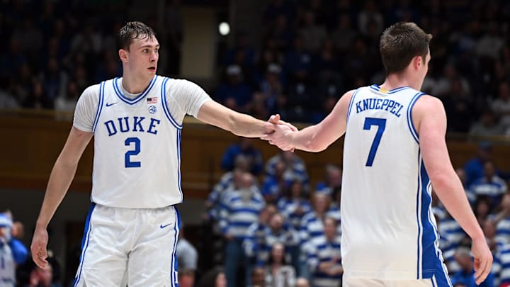 Dec 17, 2024; Durham, North Carolina, USA; Duke Blue Devils forward Cooper Flagg (2) and forward Kon Knueppel (7) react during the second half against the George Mason Patriots at Cameron Indoor Stadium. Mandatory Credit: Rob Kinnan-Imagn Images