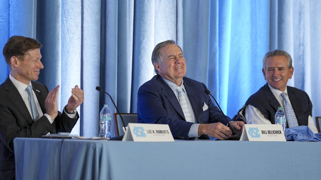 Dec 12, 2024; Chapel Hill, NC, USA;  North Carolina Tar Heels chancellor Lee Roberts, new head coach Bill Belichick and athletic director Bubba Cunningham at Loudermilk Center for Excellence. Mandatory Credit: Jim Dedmon-Imagn Images