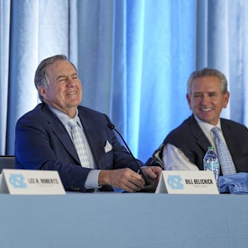 North Carolina Tar Heels chancellor Lee Roberts, head football coach Bill Belichick and athletic director Bubba Cunningham at a press conference.