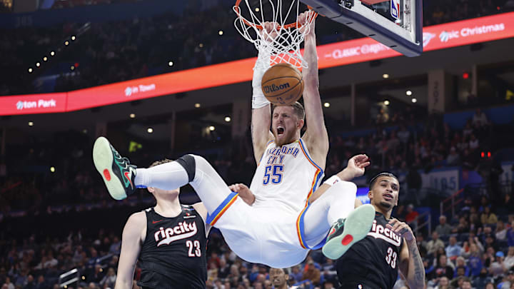 Nov 20, 2024; Oklahoma City, Oklahoma, USA; Oklahoma City Thunder center Isaiah Hartenstein (55) celebrates a dunk between Portland Trail Blazers center Donovan Clingan (23) and forward Toumani Camara (33) during the second half at Paycom Center. Mandatory Credit: Alonzo Adams-Imagn Images