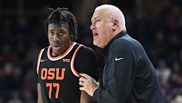 Jan 28, 2025; Spokane, Washington, USA; Oregon State Beavers head coach Wayne Tinkle, right talks with Oregon State Beavers forward Maxim Logue (77) during a game against the Gonzaga Bulldogs in the second half at McCarthey Athletic Center. Mandatory Credit: James Snook-Imagn Images