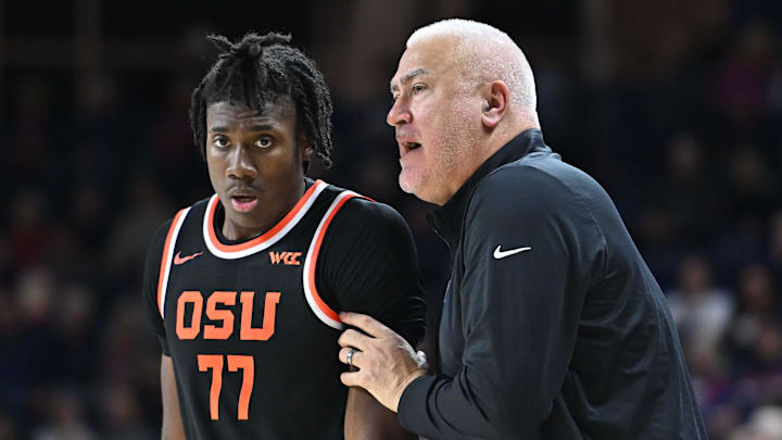 Jan 28, 2025; Spokane, Washington, USA; Oregon State Beavers head coach Wayne Tinkle, right talks with Oregon State Beavers forward Maxim Logue (77) during a game against the Gonzaga Bulldogs in the second half at McCarthey Athletic Center. Mandatory Credit: James Snook-Imagn Images Jan 28, 2025; Spokane, Washington, USA; Oregon State Beavers head coach Wayne Tinkle, right talks with Oregon State Beavers forward Maxim Logue (77) during a game against the Gonzaga Bulldogs in the second half at McCarthey Athletic Center. Mandatory Credit: James Snook-Imagn Images