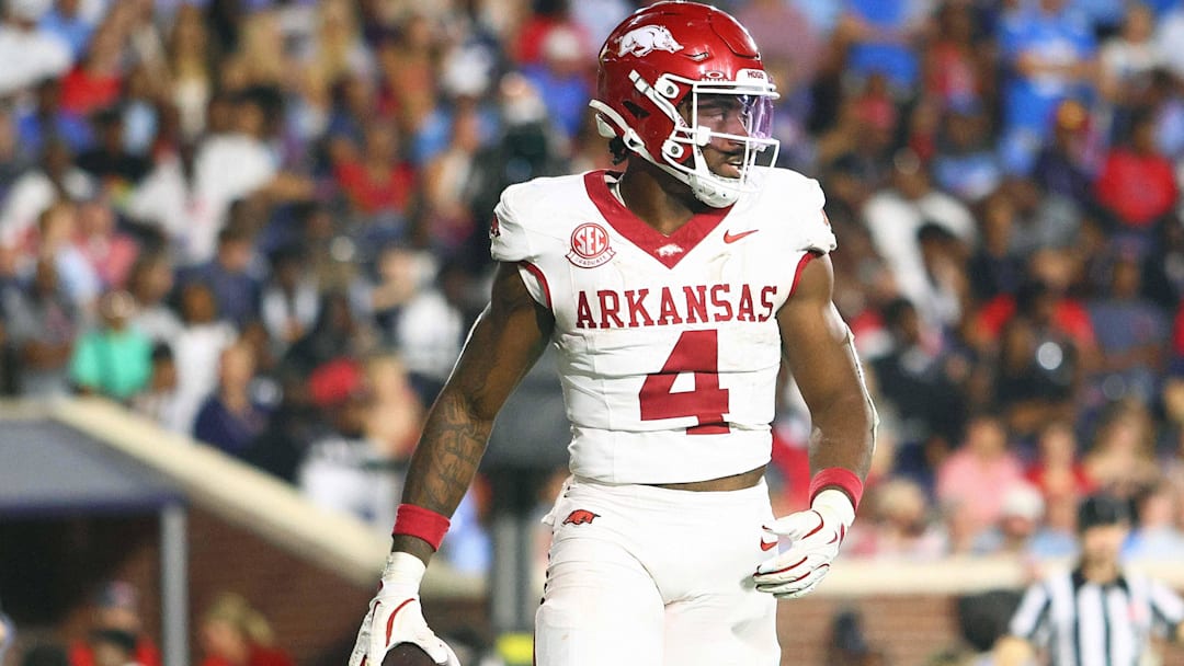 Sep 13, 2025; Oxford, Mississippi, USA; Arkansas Razorback running back Mike Washington Jr. (4) reacts after a touchdown during the fourth quarter against the Mississippi Rebels at Vaught-Hemingway Stadium. Mandatory Credit: Petre Thomas-Imagn Images