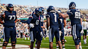 Nov 1, 2025; East Hartford, Connecticut, USA; UConn Huskies wide receiver Skyler Bell (1) is congratulated after his touchdown against the UAB Blazers in the first quarter at Pratt & Whitney Stadium at Rentschler Field. Mandatory Credit: David Butler II-Imagn Images