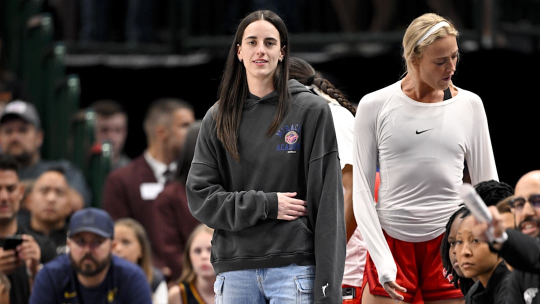 Indiana Fever guard Caitlin Clark looks on from the team bench during the game against the Dallas Wings.