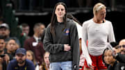Indiana Fever guard Caitlin Clark looks on from the team bench during the game against the Dallas Wings.