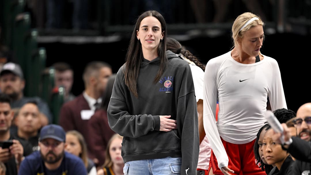 Indiana Fever guard Caitlin Clark looks on from the team bench during the game against the Dallas Wings.