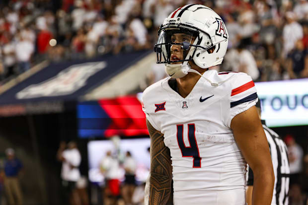 Arizona Wildcats wide receiver Tetairoa McMillan looks at the scoreboard during the third quarter at Arizona Stadium.