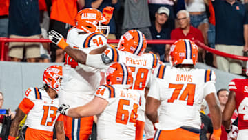 Sep 20, 2024; Lincoln, Nebraska, USA; Illinois Fighting Illini offensive lineman Brandon Henderson (94) celebrates with teammates after scoring a touchdown against the Nebraska Cornhuskers during the fourth quarter at Memorial Stadium. Mandatory Credit: Dylan Widger-Imagn Images