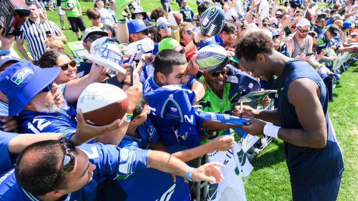 Jul 30, 2023; Renton, WA, USA; Seattle Seahawks quarterback Geno Smith (7) signs autographs after practice at the Virginia Mason Athletic Center.