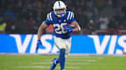 Nov 9, 2025; Berlin, Germany; Indianapolis Colts running back Jonathan Taylor (28) runs the ball against the Atlanta Falcons during the NFL Berlin Game at Olympic Stadium. Mandatory Credit: Kirby Lee-Imagn Images
