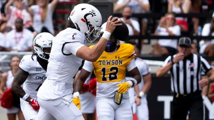 Cincinnati Bearcats quarterback Brendan Sorsby (2) scores a touchdown in the first quarter of the College Football game between the Cincinnati Bearcats and the Towson Tigers at Nippert Stadium in Cincinnati on Saturday, Aug. 31, 2024.