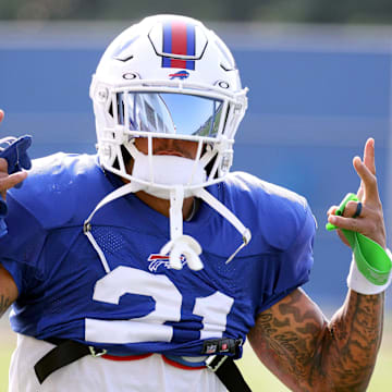 Bills safety Jordan Poyer shares a laugh at the start of practice.