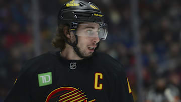 Nov 23, 2025; Vancouver, British Columbia, CAN;  Vancouver Canucks defenseman Quinn Hughes (43) looks on during the second period against the Calgary Flames at Rogers Arena. Mandatory Credit: Simon Fearn-Imagn Images