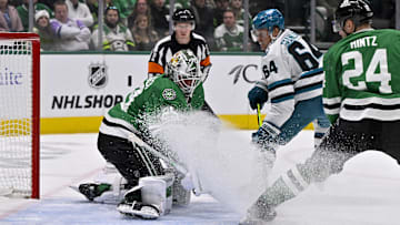 Nov 20, 2024; Dallas, Texas, USA; San Jose Sharks center Mikael Granlund (64) scores a short-handed goal against Dallas Stars goaltender Jake Oettinger (29) during the first period at the American Airlines Center. Mandatory Credit: Jerome Miron-Imagn Images