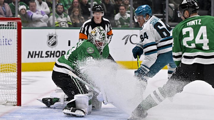 Nov 20, 2024; Dallas, Texas, USA; San Jose Sharks center Mikael Granlund (64) scores a short-handed goal against Dallas Stars goaltender Jake Oettinger (29) during the first period at the American Airlines Center. Mandatory Credit: Jerome Miron-Imagn Images