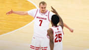 Wisconsin Badgers guard Andrew Rohde (7) celebrates with guard John Blackwell in the first half of the Big Ten opener against Northwestern.