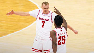 Wisconsin Badgers guard Andrew Rohde (7) celebrates with guard John Blackwell in the first half of the Big Ten opener against Northwestern.