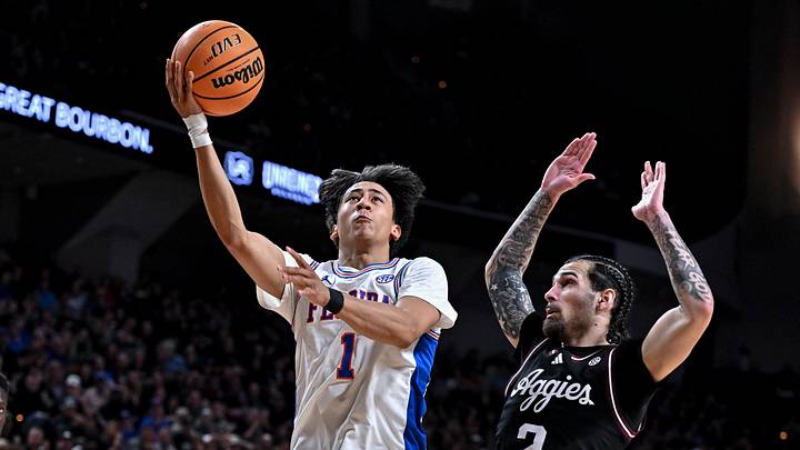 Feb 7, 2026; College Station, Texas, USA; Florida Gators guard Xaivian Lee (1) goes to the basket against Texas A&M Aggies guard Pop Isaacs (2) during the first half at Reed Arena. Mandatory Credit: Maria Lysaker-Imagn Images