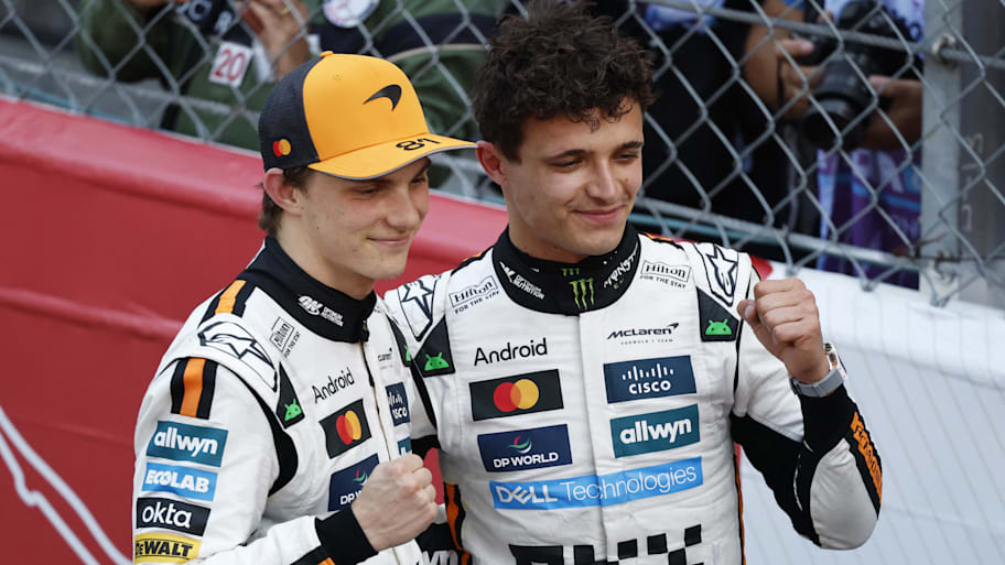 McLaren's Lando Norris celebrates after winning the Monaco Grand Prix alongside teammate Oscar Piastri, who finished third. | Stephanie Lecocq/Reuters via Imagn Images