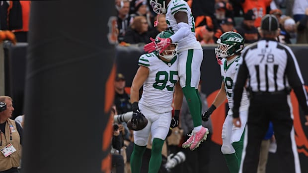 New York Jets tight end Mason Taylor celebrates after scoring a touchdown with wide receiver Tyler Johnson.