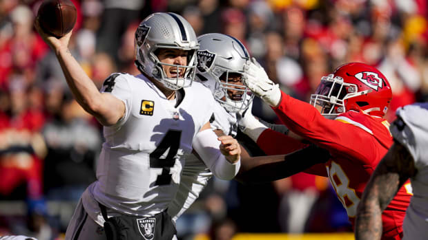 Dec 12, 2021; Raiders quarterback Derek Carr (4) throws a pass under pressure against the Kansas City Chiefs