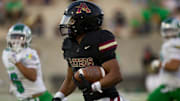 El Dorado's Ryan Estrada (1) runs the ball during a football game against Montwood on Friday, Sept. 13, 2024, at the Socorro ISD Student Activities Complex 2 in El Paso.