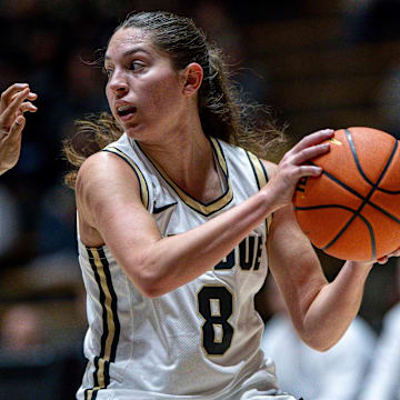 Purdue Freshman Hila Karsh (8) looks for a pass 