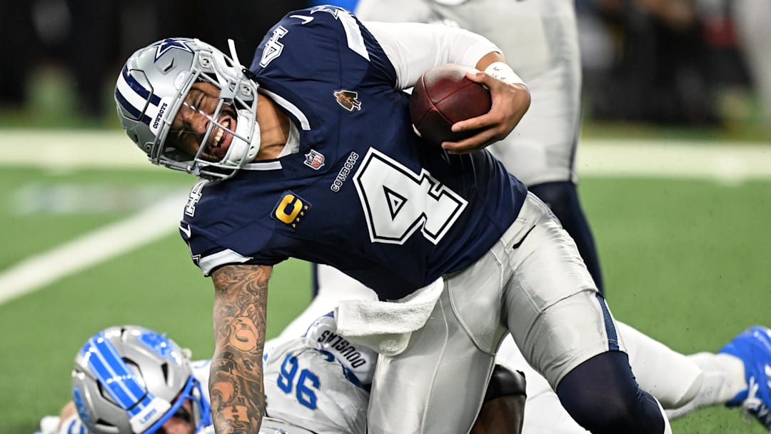 Dallas Cowboys quarterback Dak Prescott is sacked by Detroit Lions DE Al-Quadin Muhammad.