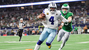 Nov 23, 2025; Arlington, Texas, USA; Dallas Cowboys quarterback Dak Prescott (4) runs with the ball in attempt to score a touchdown in the fourth quarter against the Philadelphia Eagles at AT&T Stadium. 