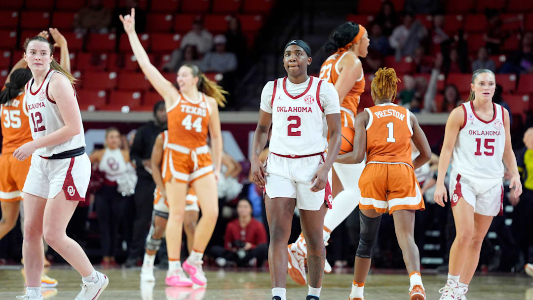 Oklahoma Sooners guard Reyna Scott (2), guard Payton Verhulst (12) and Lexy Keys (15) walk off the court as Texas celebrates during a women's college basketball game between the University of Oklahoma Sooners (OU) and the Texas Longhorns at Lloyd Noble Center in Norman, Okla., Thursday, Jan. 2, 2025.
