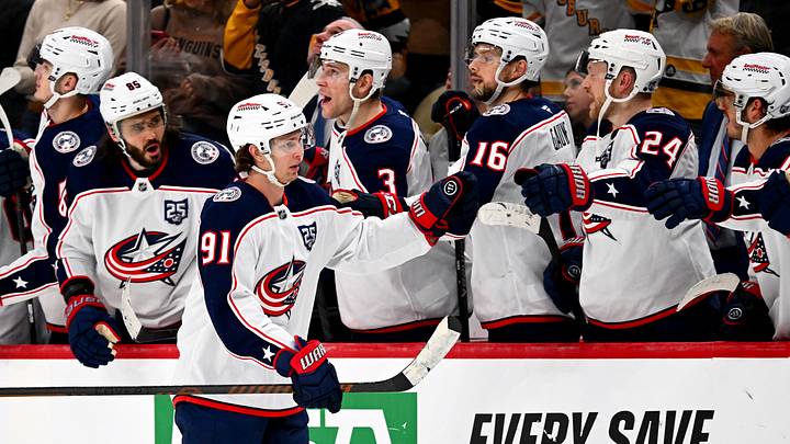 Blue Jackets forward Kent Johnson celebrates a shootout goal with his teammates.