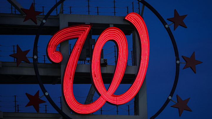 The Curly W, surrounded by 3 Stars on either side.