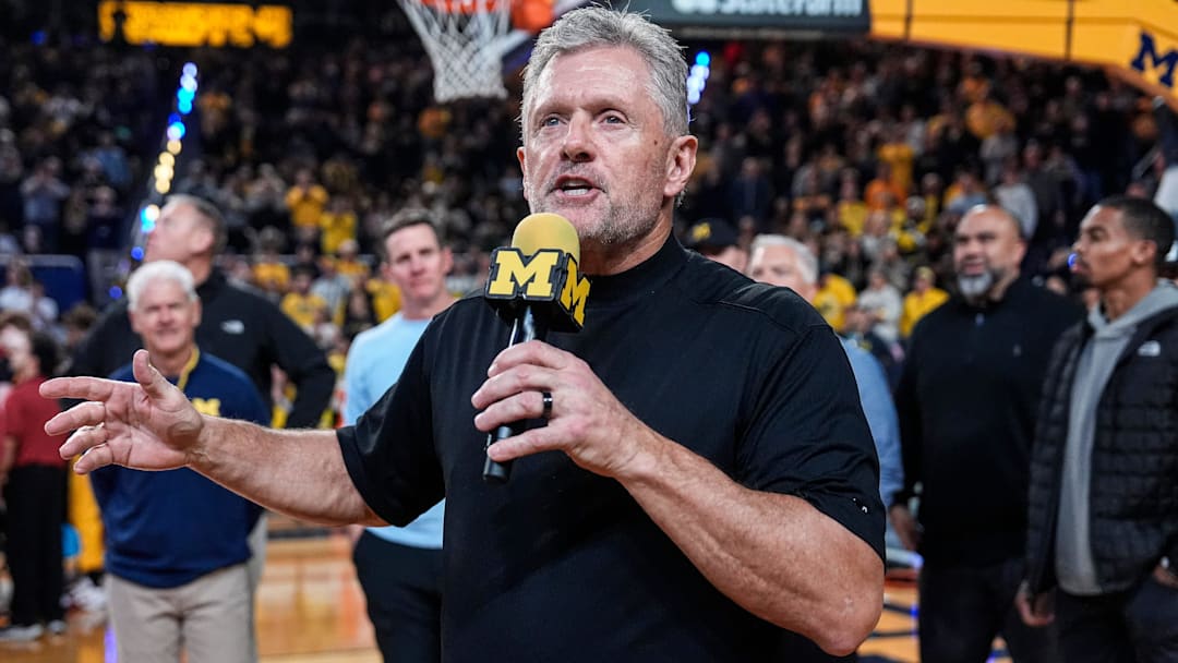 Michigan football head coach Kyle Whittingham speaks as he is being introduced on the floor during the first half between Michigan and USC at Crisler Center in Ann Arbor on Friday, Jan. 2, 2026. Michigan football head coach Kyle Whittingham speaks as he is being introduced on the floor during the first half between Michigan and USC at Crisler Center in Ann Arbor on Friday, Jan. 2, 2026.