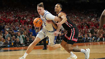 Apr 5, 2025; San Antonio, TX, USA; Duke Blue Devils forward Cooper Flagg (2) drives to the basket against Houston Cougars guard Milos Uzan (7) during the second half in the semifinals of the men's Final Four of the 2025 NCAA Tournament at the Alamodome. Mandatory Credit: Bob Donnan-Imagn Images