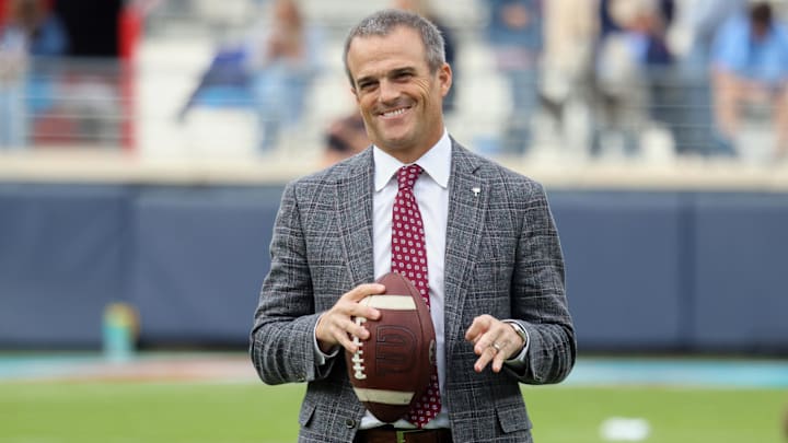Nov 1, 2025; Oxford, Mississippi, USA; South Carolina Gamecocks head coach Shane Beamer holds a football and reacts on the field before the game against the Mississippi Rebels.