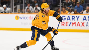 Apr 14, 2025; Nashville, Tennessee, USA;  Nashville Predators center Jonathan Marchessault (81) takes a shot on goal against the Utah Hockey Club during the first period at Bridgestone Arena. Mandatory Credit: Steve Roberts-Imagn Images