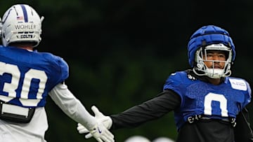 Indianapolis Colts safety Camryn Bynum (0) high-fives Indianapolis Colts safety Hunter Wohler (30) on Thursday, July 31, 2025, during Colts Training Camp at Grand Park in Westfield.