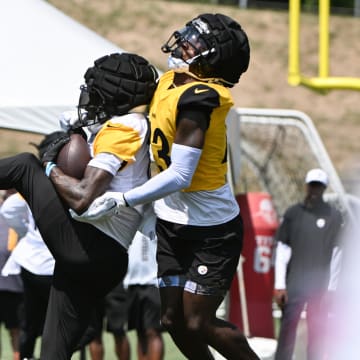 Jul 28, 2024; Latrobe, PA, USA; Pittsburgh Steelers wide receiver Quez Watkins (16) catches a pass in front of safety Damontae Kazee (23) during training camp at Saint Vincent College. Mandatory Credit: Barry Reeger-USA TODAY Sports