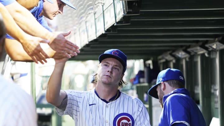 Aug 4, 2024; Chicago, Illinois, USA; Chicago Cubs pitcher Justin Steele (35) is greeted in the dugout after leaving the game against the St. Louis Cardinals during the seventh inning at Wrigley Field. 