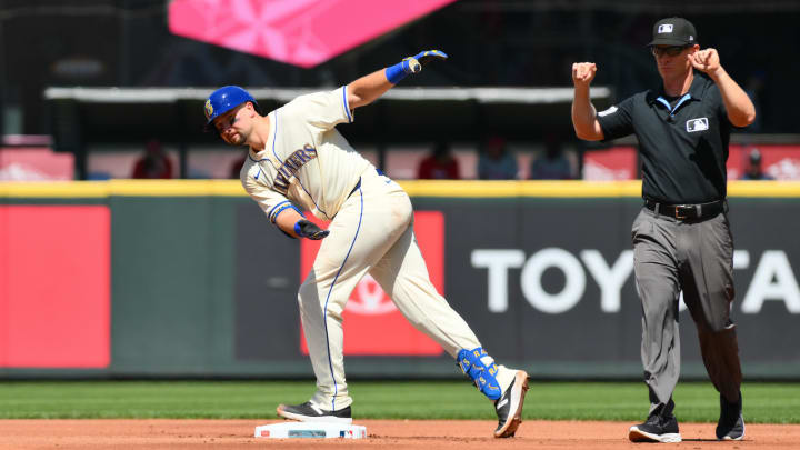 Seattle Mariners catcher Cal Raleigh (left) celebrates after hitting a double against the Philadelphia Phillies on Sunday at T-Mobile Park.