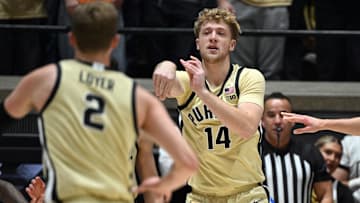 Purdue Boilermakers guard Jack Benter (14) passes the ball