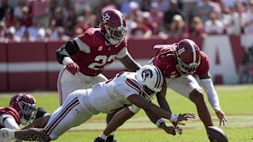 Oct 12, 2024; Tuscaloosa, Alabama, USA;  South Carolina Gamecocks quarterback LaNorris Sellers (16) fights for a fumble with Alabama Crimson Tide defensive lineman LT Overton (22) and Alabama Crimson Tide linebacker Jihaad Campbell (11) at Bryant-Denny Stadium. Alabama defeated South Carolina 27-25. Mandatory Credit: Gary Cosby Jr.-Imagn Images