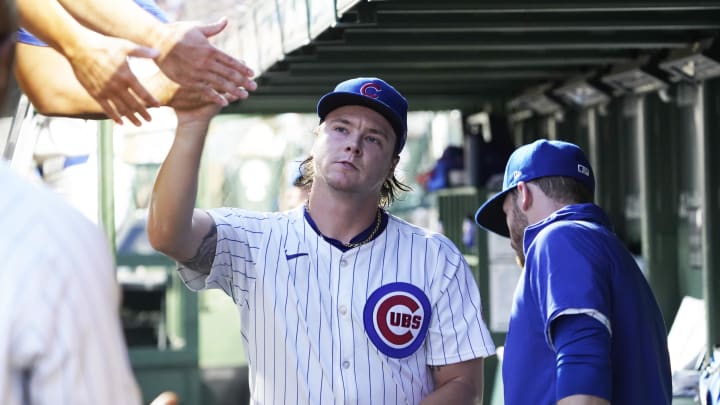 Aug 4, 2024; Chicago, Illinois, USA; Chicago Cubs pitcher Justin Steele (35) is greeted in the dugout after leaving the game against the St. Louis Cardinals during the seventh inning at Wrigley Field. 