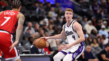 Nov 22, 2024; Inglewood, California, USA;  Sacramento Kings guard Kevin Huerter (9) looks to pass against Los Angeles Clippers guard Amir Coffey (7) during the third quarter at Intuit Dome. Mandatory Credit: Kiyoshi Mio-Imagn Images