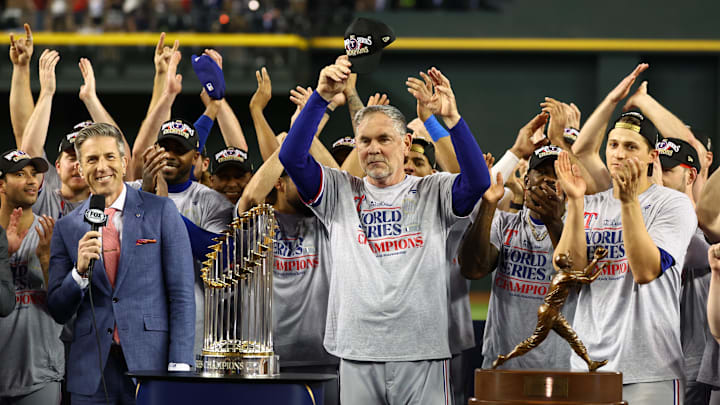 Texas Rangers manager Bruce Bochy celebrates with the team after winning the 2023 World Series against the Arizona Diamondbacks.