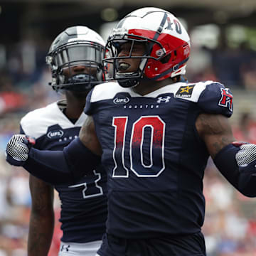 Mar 31, 2024; Houston, TX, USA; Houston Roughnecks linebacker Reuben Foster (10) celebrates after an interception in the third quarter of a game against the Memphis Showboats at Rice Stadium. Mandatory Credit: Joseph Buvid-Imagn Images