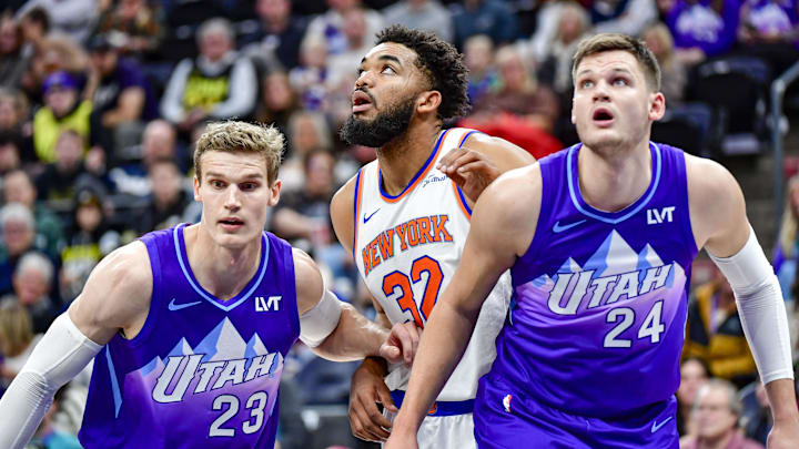 Nov 23, 2024; Salt Lake City, Utah, USA; Utah Jazz forward/center Lauri Markkanen (23) and center Walker Kessler (24) battle for position against New York Knicks center/forward Karl-Anthony Towns (32) during a free-throw during the first half at the Delta Center. Mandatory Credit: Christopher Creveling-Imagn Images