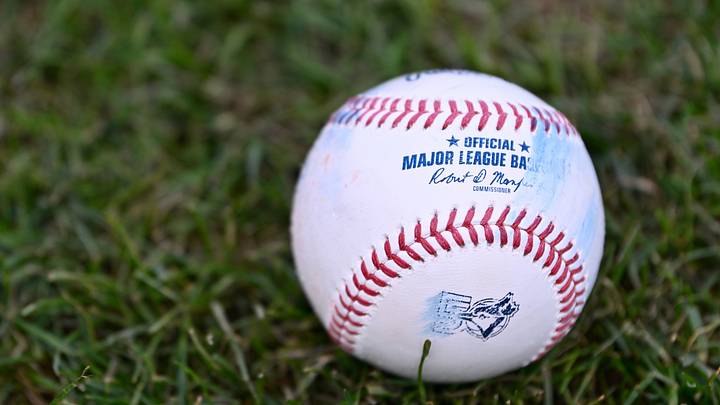 Jul 24, 2026; Boston, Massachusetts, USA; An official MLB baseball with a Toronto Blue Jays logo sits on the grass before a game against the Boston Red Sox at Fenway Park. Mandatory Credit: Eric Canha-Imagn Images