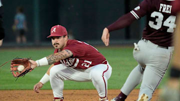 Alabama second baseman Brennen Norton (21) tags out Mississippi State base runner Gehrig Frei at Sewell-Thomas Stadium in Tuscaloosa Friday, April 11, 2025.